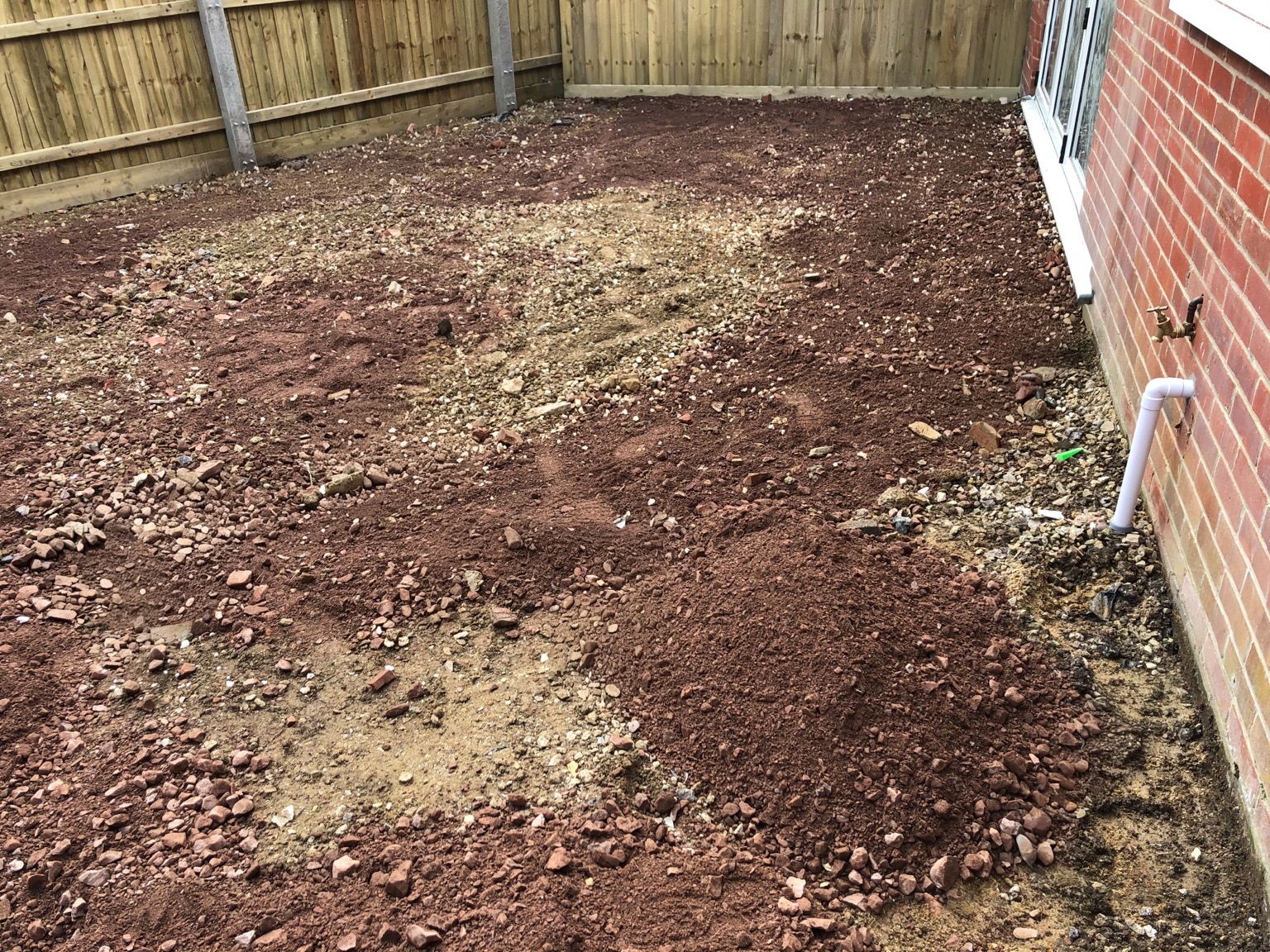 Ground Preparation for Porcelain patio & artificial grass by Stonecrest Paving and Landscaping in Gloucester
